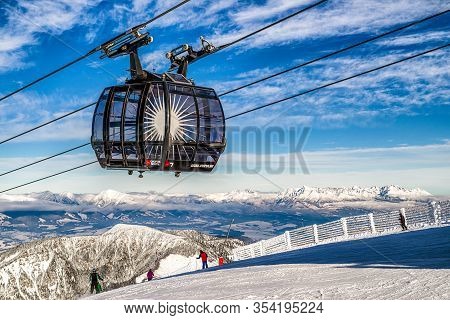 Demanovska Dolina, Slovakia - December 2: Ropeway Funitel And Skiers On Hill Chopok In Resort Jasna 