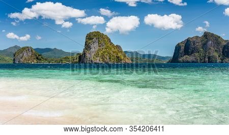 El Nido, Philippines. Panorama Of Limestone Islands In El Nido Lagoon. Private Malapacao Island In B