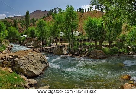Tajikistan. The Right Tributary Of The Border River Panj Along The Pamir Tract Near The City Of Khor