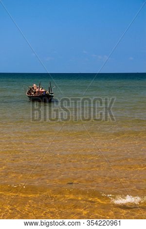 Small Fishing Boat Near The Beach In Thailand