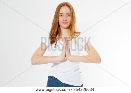Indoor Closeup Of Beautiful Red-head Woman In White T-shirt Isolated On Light Background Practicing