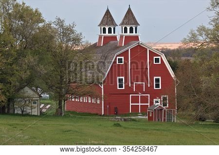 Granddaddy Of All Barns Proudly Showing Off Its Colors At Sundown