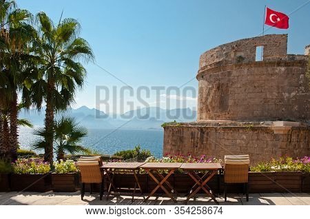 Flag Of Turkey Above The Hidirlik Tower, Karaalioglu Park In The Historic Town Kaleici, Antalya, Tur