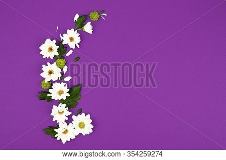 Background With White Flowers And Empty Notebook For Text On Purpule Table. Place For Text. Top View