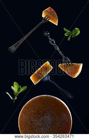 Pieces Of Hard Cheeses On Vintage Forks On A Black Background Are Located Above The Whole Head Of Ch