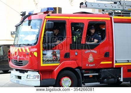 Monte-carlo, Monaco - June 20, 2019: Man Drives A Red Fire Truck Renault Midlum In Front Of The Mont