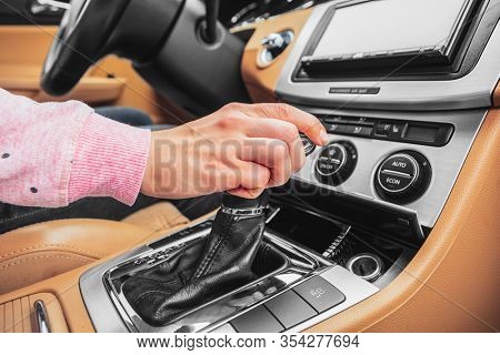 woman driver hand shifting the gear stick