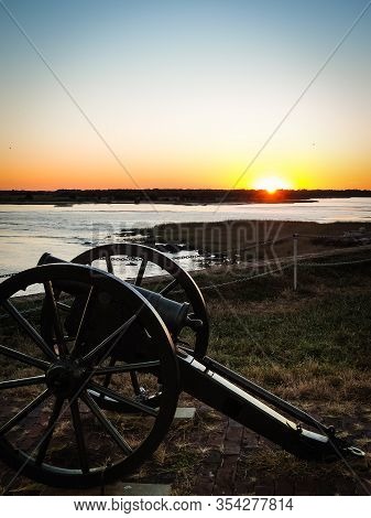 Historic Civil War Cannon On Fort Sumter Island Near Charleston, South Carolina Before Beautiful Ora