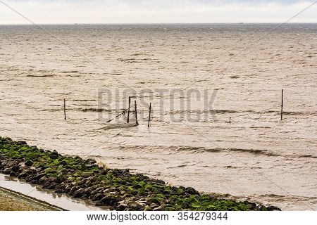 Coast Of Ijsselmeer Near To Den Oever By  Afsluitdijk Monument In Netherlands