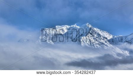 Mont Blanc Above The Clouds In Winter.