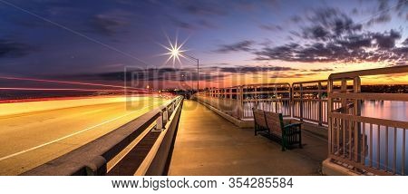Light Trails From Cars Headed Across The Ss Jolley Bridge Into Marco Island, Florida.