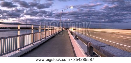 Light Trails From Cars Headed Across The Ss Jolley Bridge Into Marco Island, Florida.