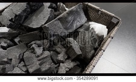 Black Wooden Charcoal On Black Background Top View