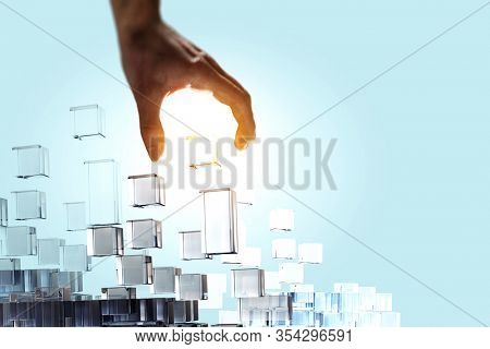 Hand holding glowing cubes. Innovation and creativity concept.