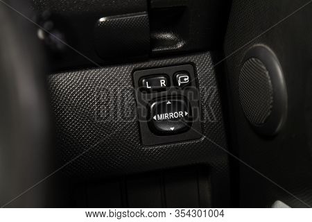 Novosibirsk, Russia -  January 24, 2020: Toyota Ractis, Close-up Of The   Side Mirror Setting Button