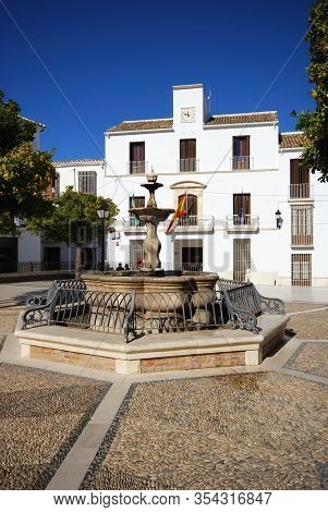 Estepa, Spain - November 13, 2008 - Fountain In The Plaza Del Carmen With The Town Hall (ayuntamient