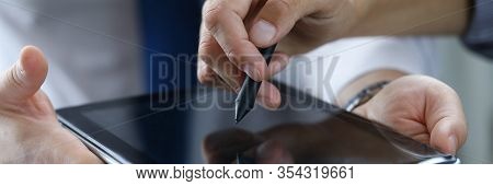 Focus On Male Hands Holding Modern Tablet. Business Partner Showing Something With Stylos. Empty Cop