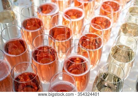 Rows Of Glasses Of Red Prosseco And Champagne