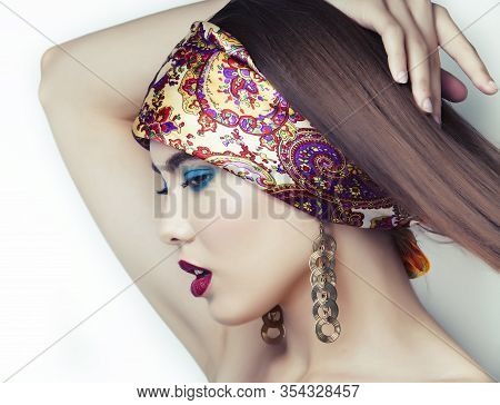 Young Pretty Modern Girl With Bright Shawl On Head Emotional Posing Isolated On White Background, As