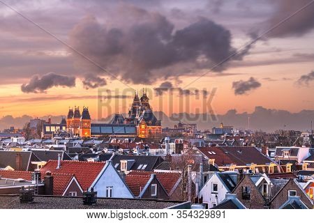 Amsterdam, Netherlands rooftop view at dusk.
