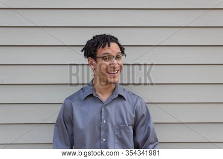 Young Bi-racial Male, Quarter Turn With Open Smile, Happy Man With Natural Hairstyle Dreadlocks, Hor
