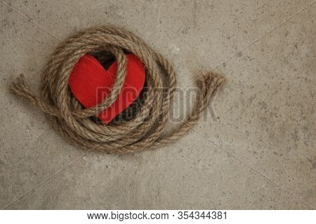 Heart And Rope On A Concrete Floor. Sexual Abuse Concept , Fatal Love, Dominant Conceptual