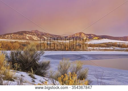 Frozen Colorado Lake At Sunrise