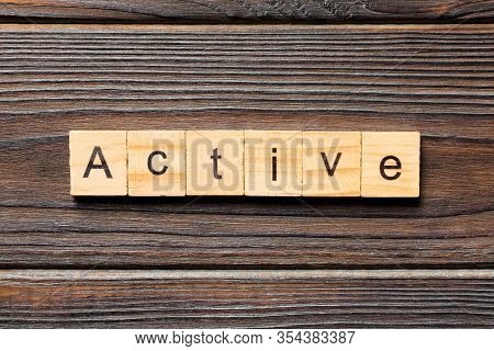 Active Word Written On Wood Block. Active Text On Table, Concept
