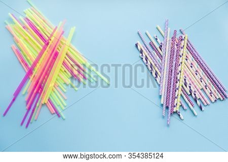 Plastic Vs Paper Drinking Straws On A Blue Background. Zero Waste Sustainable Living, Plasticfree Co