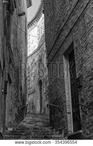Ripatransone, Ascoli Piceno, Marches, Italy: Typical Street Of The Historic Town At Morning. Black A