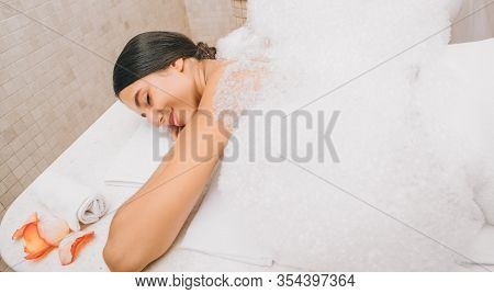 Beautiful Mixed Race Woman Enjoying Warm Foam In Hammam. Body Recovery At Hamam, Turkish Bath