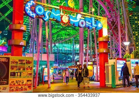 Yokohama, Japan - April 21, 2017: People At Entrance And Signboard Of Cosmo World Amusement Park In 