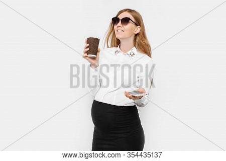 Image Of A Young Pregnant Businesswoman Wearing Glasses, A Girl Holding A Smartphone And Drinking Co