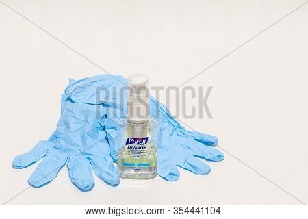 St Elizabeth, Jamaica - March 06 2020: Purell Advanced Hand Sanitizer Gel & Disposable Gloves On Whi