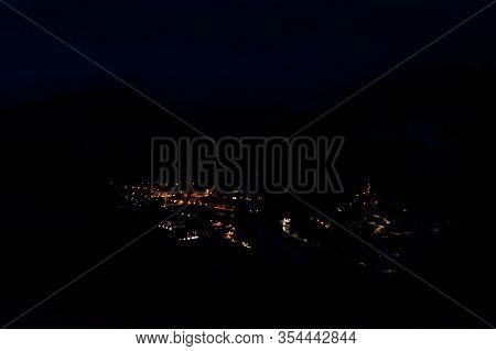 The Panoramic View Of A Medieval French Village Puget-theniers At Night In The Dark
