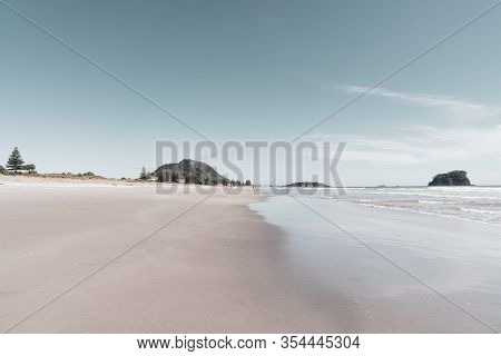 Ocean Beach With Mount Maunganui At End, Wide And Flat Sandy Area In Vintage Effect.