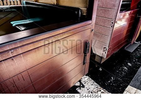 A Vintage Perspective Shot Of Traditional Wooden Steam Train Bogey Inside Melbourne, Australia