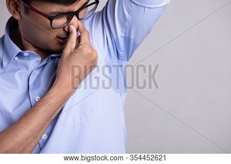 Close Up Asian Man With Hyperhidrosis Sweating. Young Asia Man With Sweat Stain On His Clothes Again