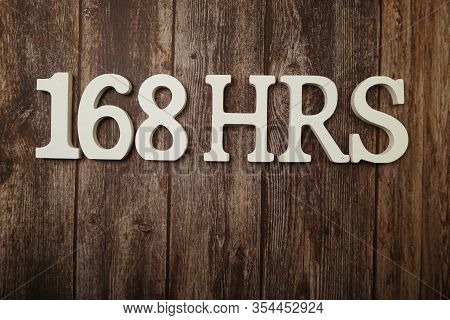 168 Hrs Number Of Hours In A Week With Space Copy On Wooden Background