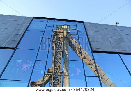 Headframe Of C-mine In Belgium Reflected In Glass