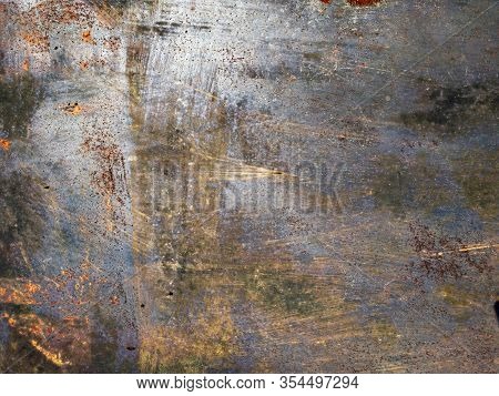 Rusty Silver Metal Texture. Gray, Purple And Orange. Grunge Texture Of A Garage Wall. Scratched Meta