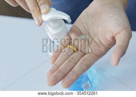 Hand Of Woman That Applying Alcohol Gel To Make Cleaning And Clear Germ, Bacteria, Health Care Conce