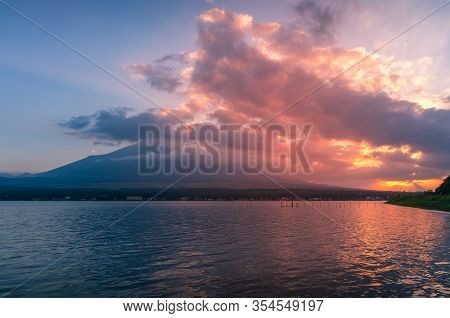 Lake Landscape At Sunset With Mount Fuji In The Clouds On The Background. Lake Yamanaka With Fuji Mo