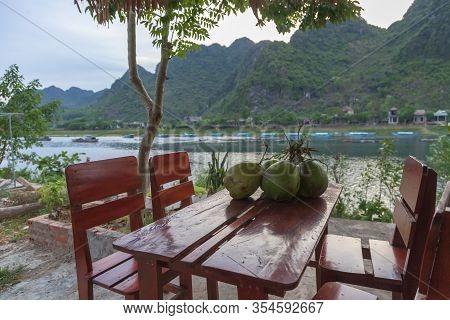 Phong Nha, Vietnam, A Bunch Of Coconuts Lies On A Table