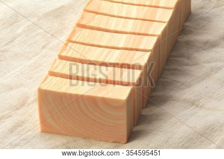 Organic Cold Process Soap Cut Into Bar Form On Linen Background