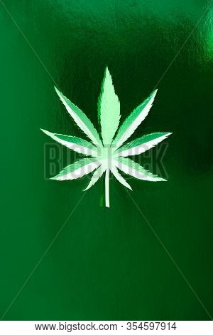 Cannabis Leaf Made Of Paper On Green Background