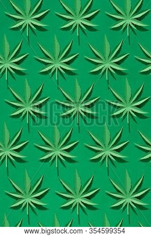 Cannabis Leaf Made Of Paper On Green Background