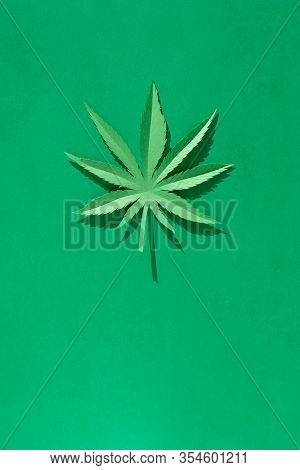Cannabis Leaf Made Of Paper On Green Background