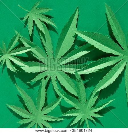 Cannabis Leaf Made Of Paper On Green Background