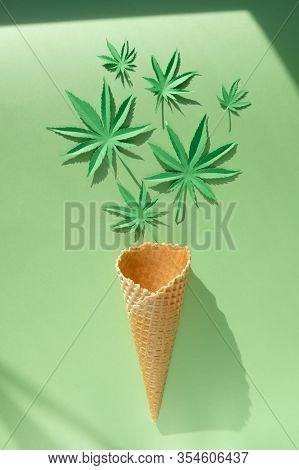 Cannabis Leaf Made Of Paper On Green Background